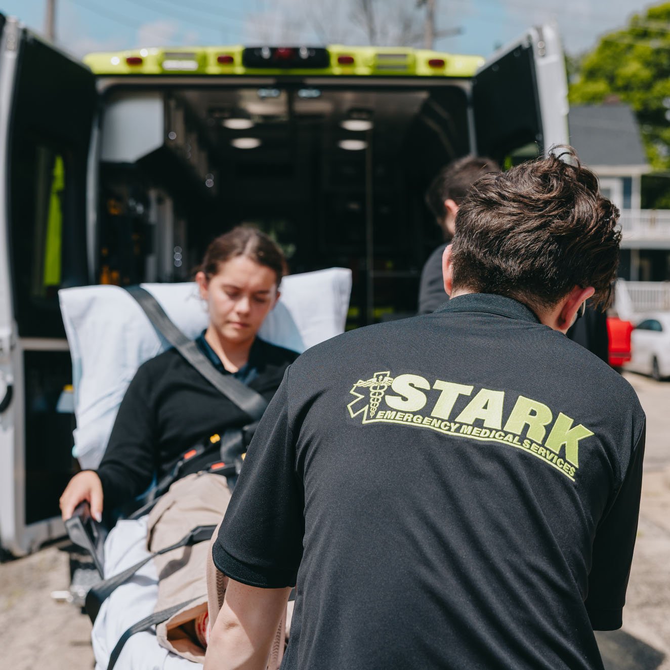 Stark County Ambulance crew loading a patient through the rear doors