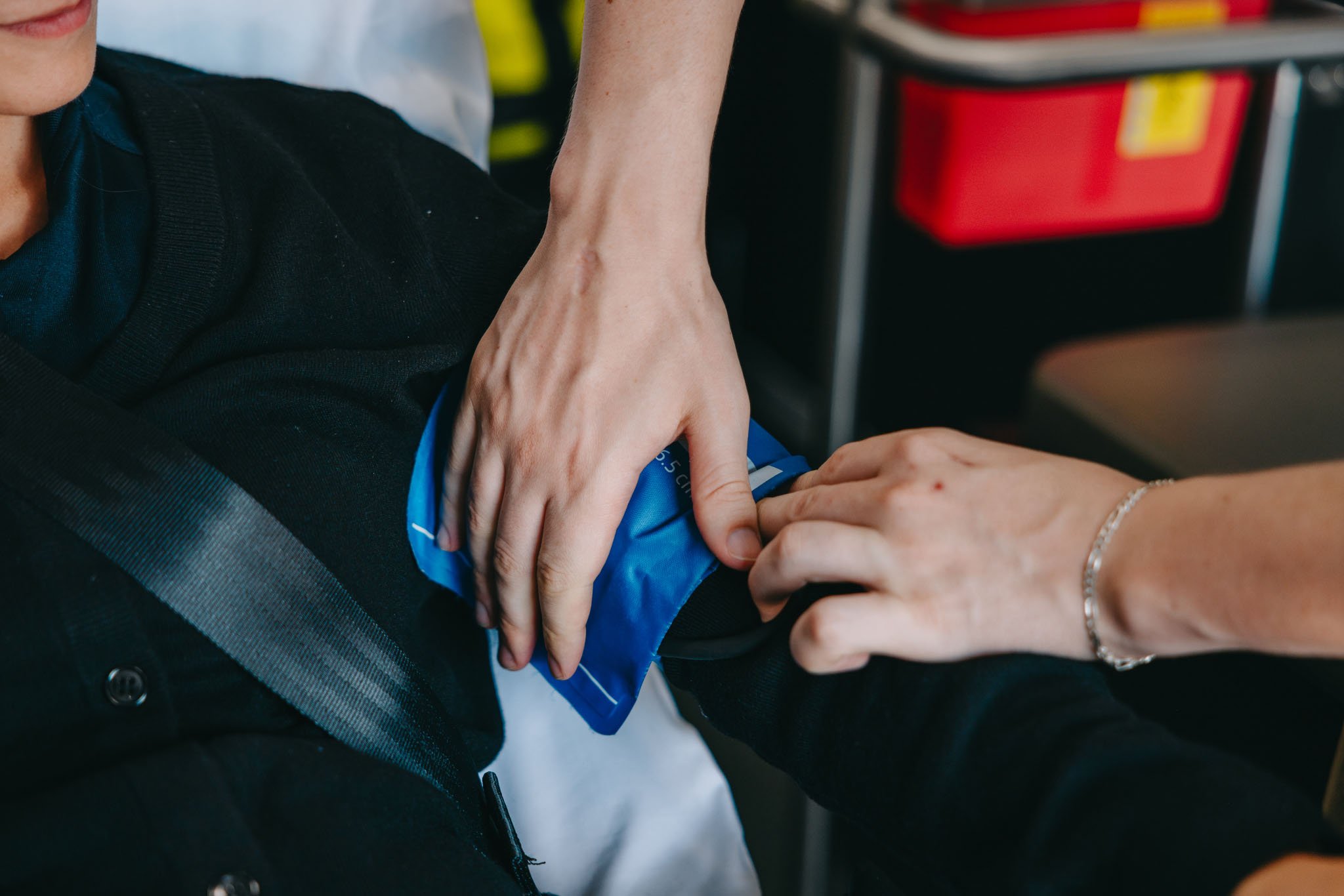 Stark County paramedic applying a tourniquet to a patient's arm