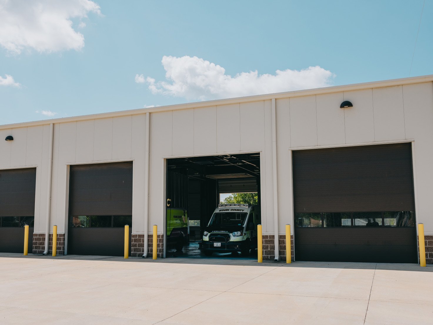Stark County Ambulance station with open apparatus bay doors