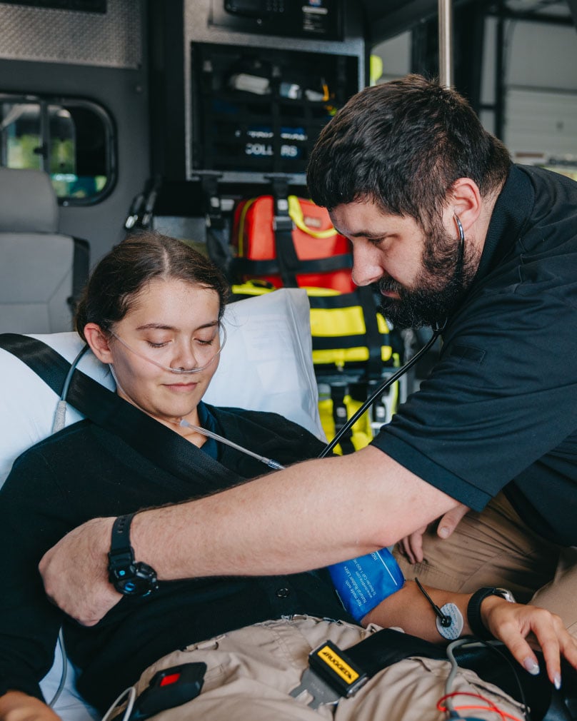 Stark County paramedic providing care to a patient during transport
