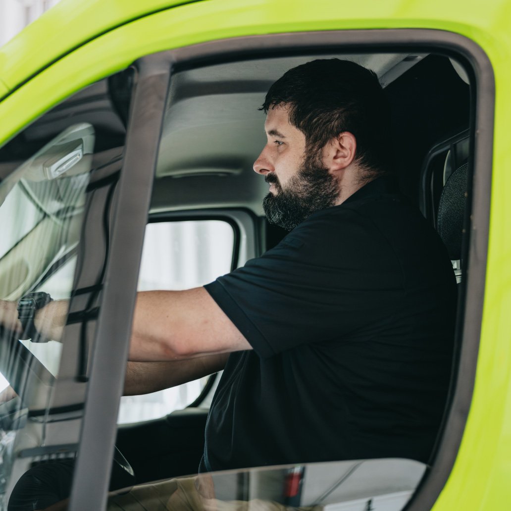 Stark County Ambulance paramedic in the cab of an ambulance