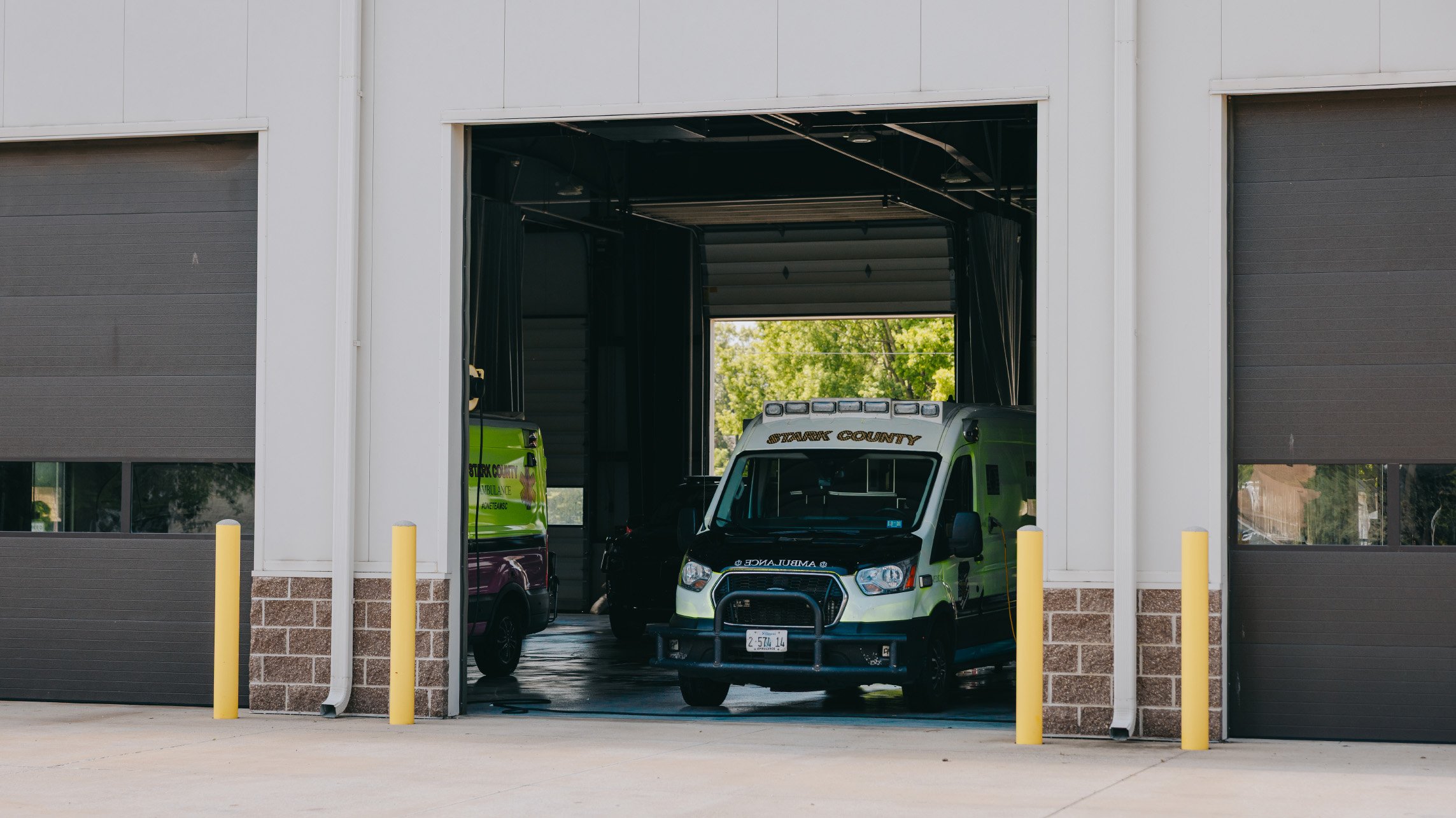 Stark County Ambulance unit inside an open station bay