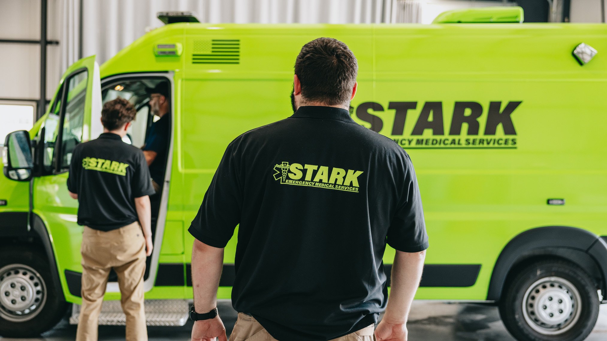 Stark County Ambulance crew outside an ambulance on a call