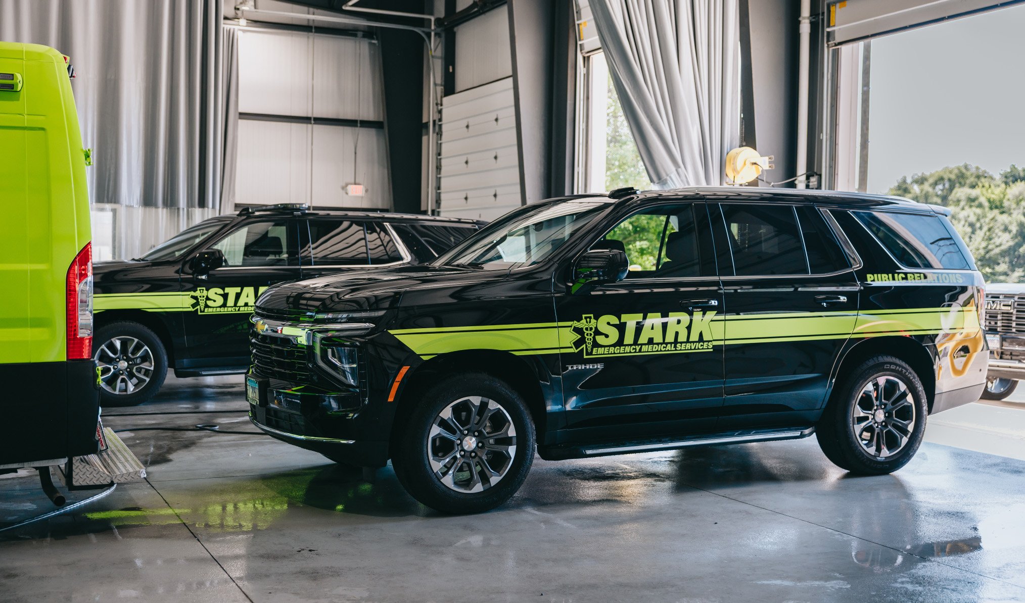Stark County Ambulance response SUVs parked inside a station bay