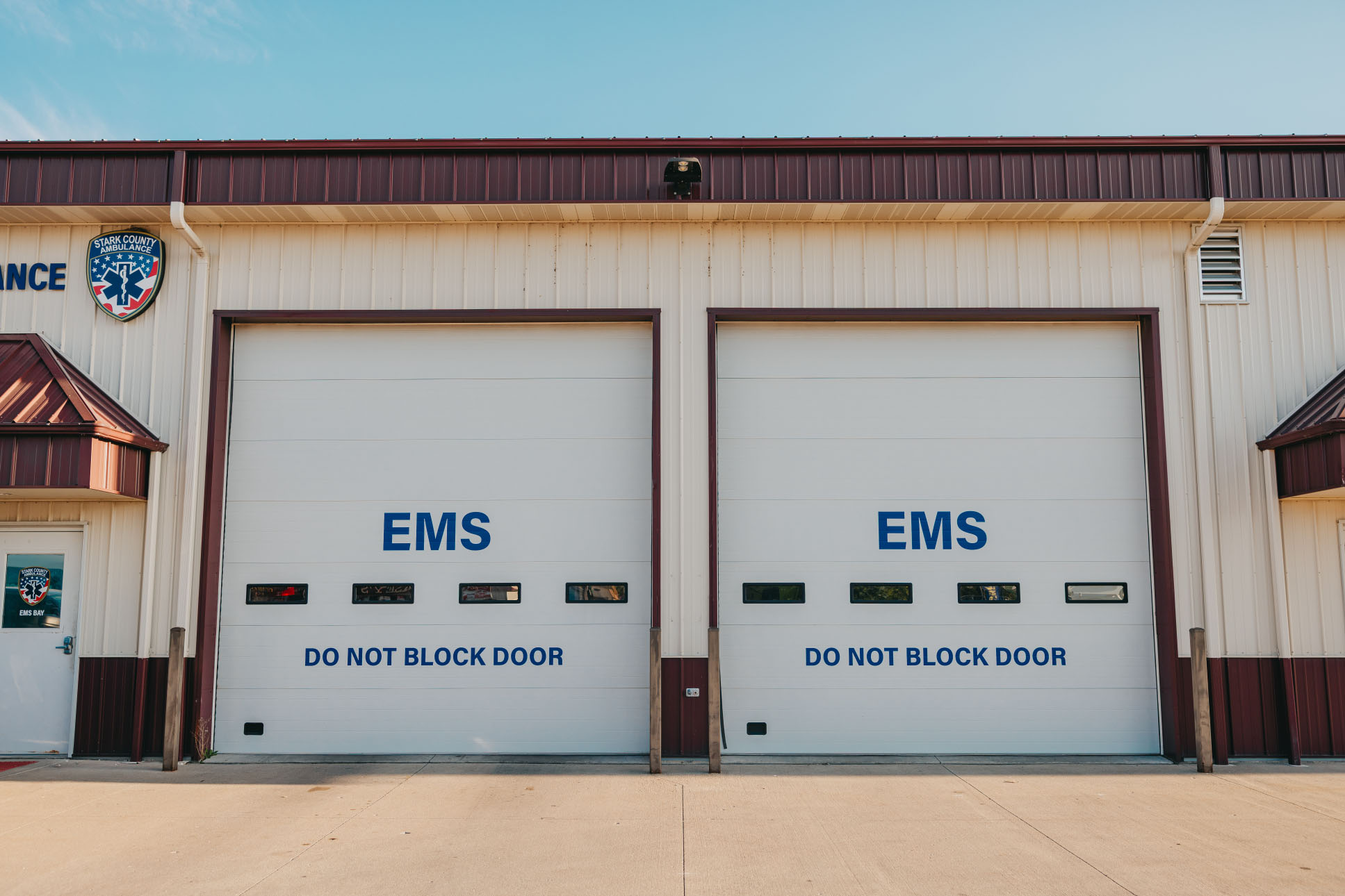 Two marked EMS bay doors at the Stark County Ambulance Bradford station