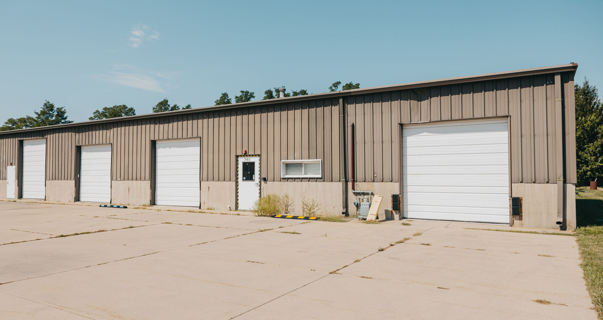 Stark County Ambulance Ottawa station with a row of apparatus bay doors along the lot