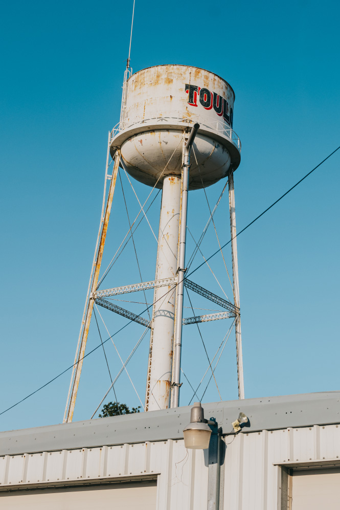 Toulon water tower rising above the Stark County Ambulance Toulon station in Stark County, Illinois