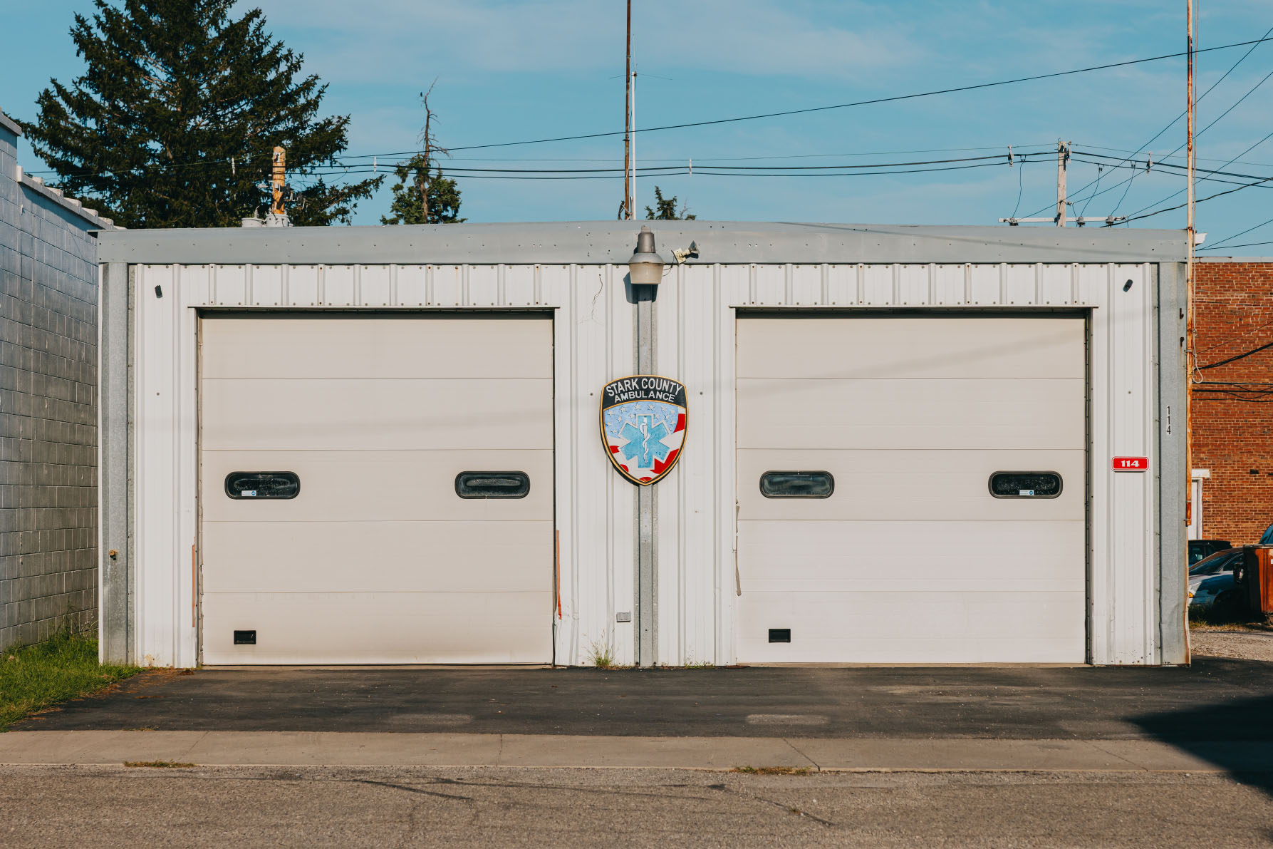 Stark County Ambulance shield between the two bay doors at the Toulon station in Toulon, Illinois