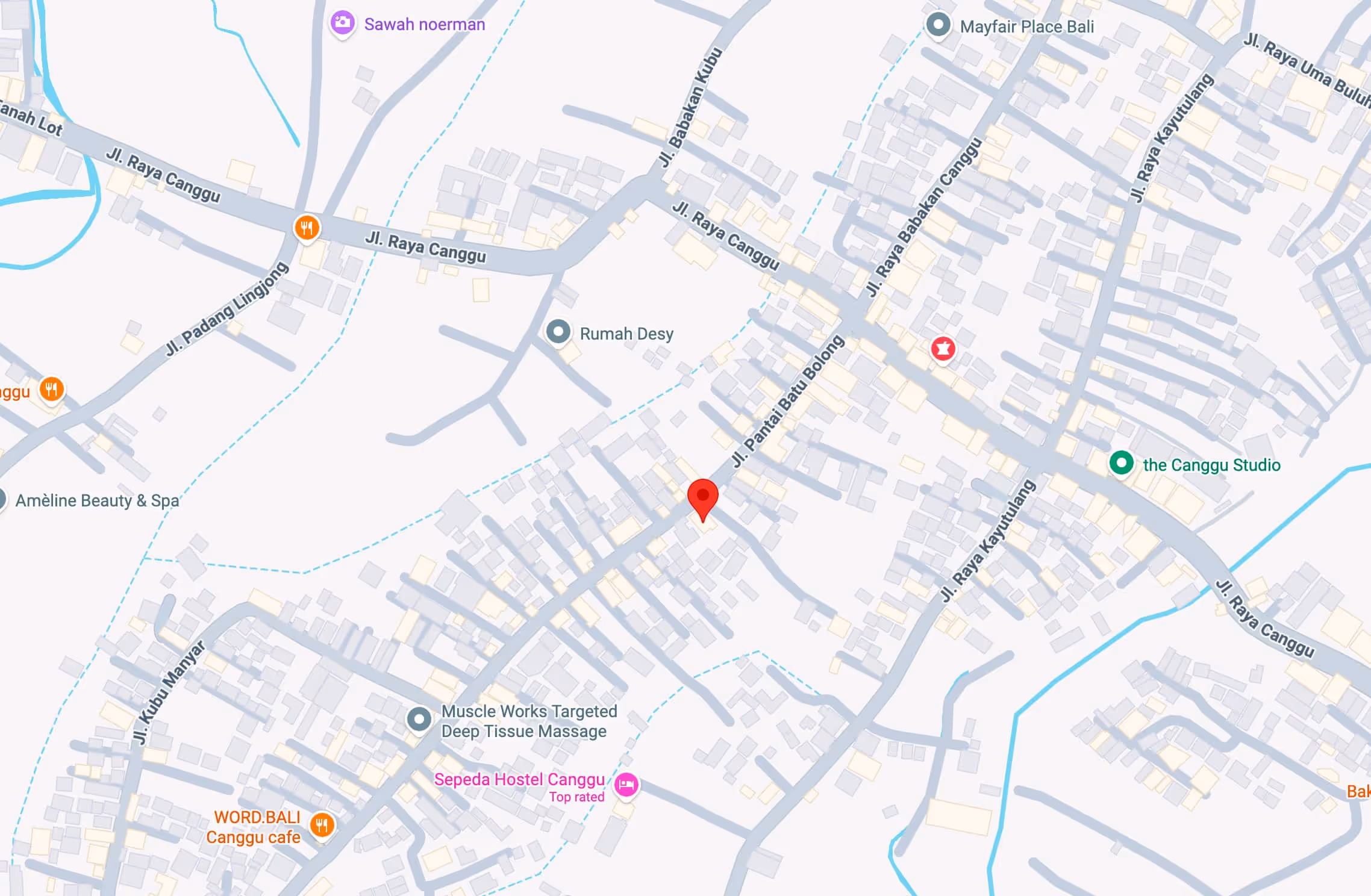 Map of Canggu, Bali showing streets including Jl. Raya Canggu, Jl. Pantai Batu Bolong, and Jl. Raya Kayu Tulang with landmarks such as Sepeda Hostel Canggu, Muscle Works Targeted Deep Tissue Massage, Amèline Beauty & Spa, and the Canggu Studio.