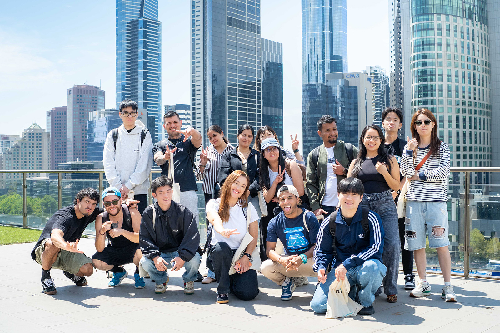 Group of Danford College students posing together in front of the Melbourne skyline