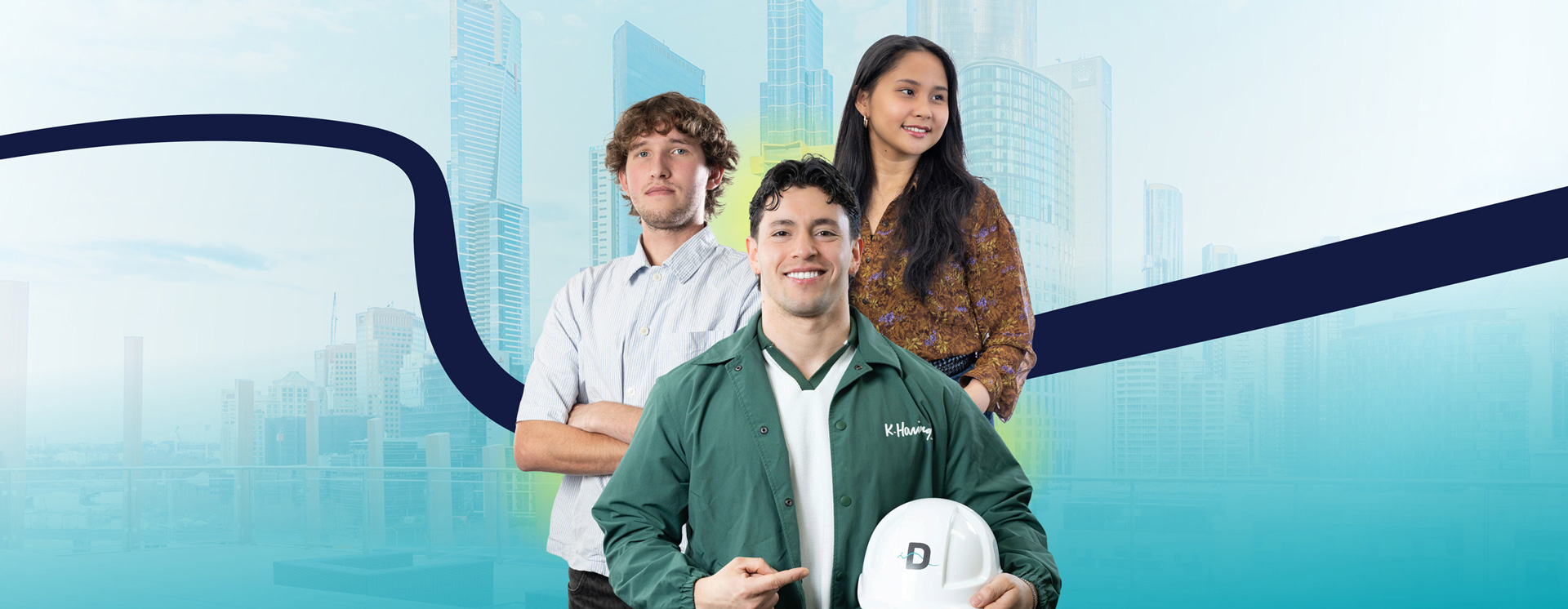 A Danford College construction trainee holding a branded hard hat, flanked by two fellow students, with the Melbourne skyline behind them