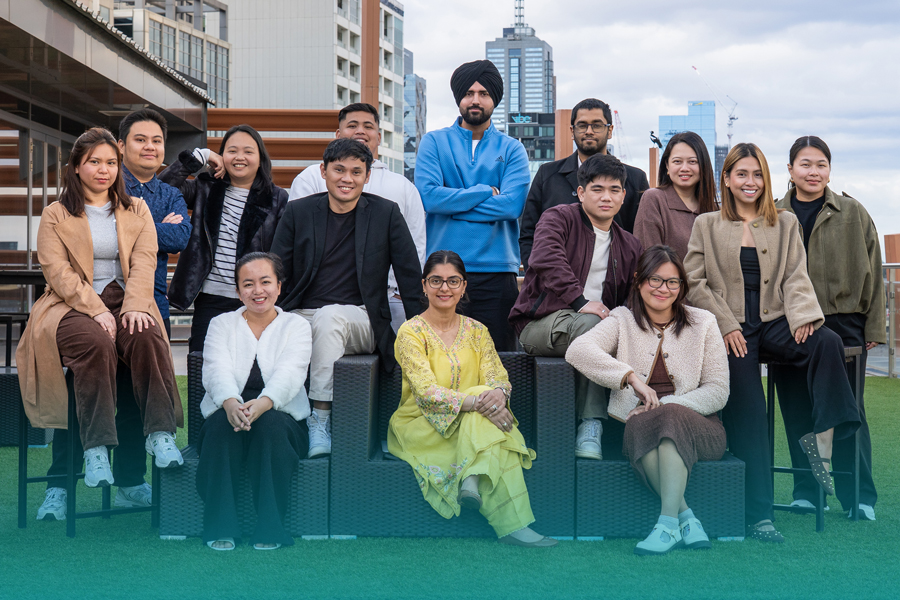 A group of Danford College students and staff posing together on a rooftop