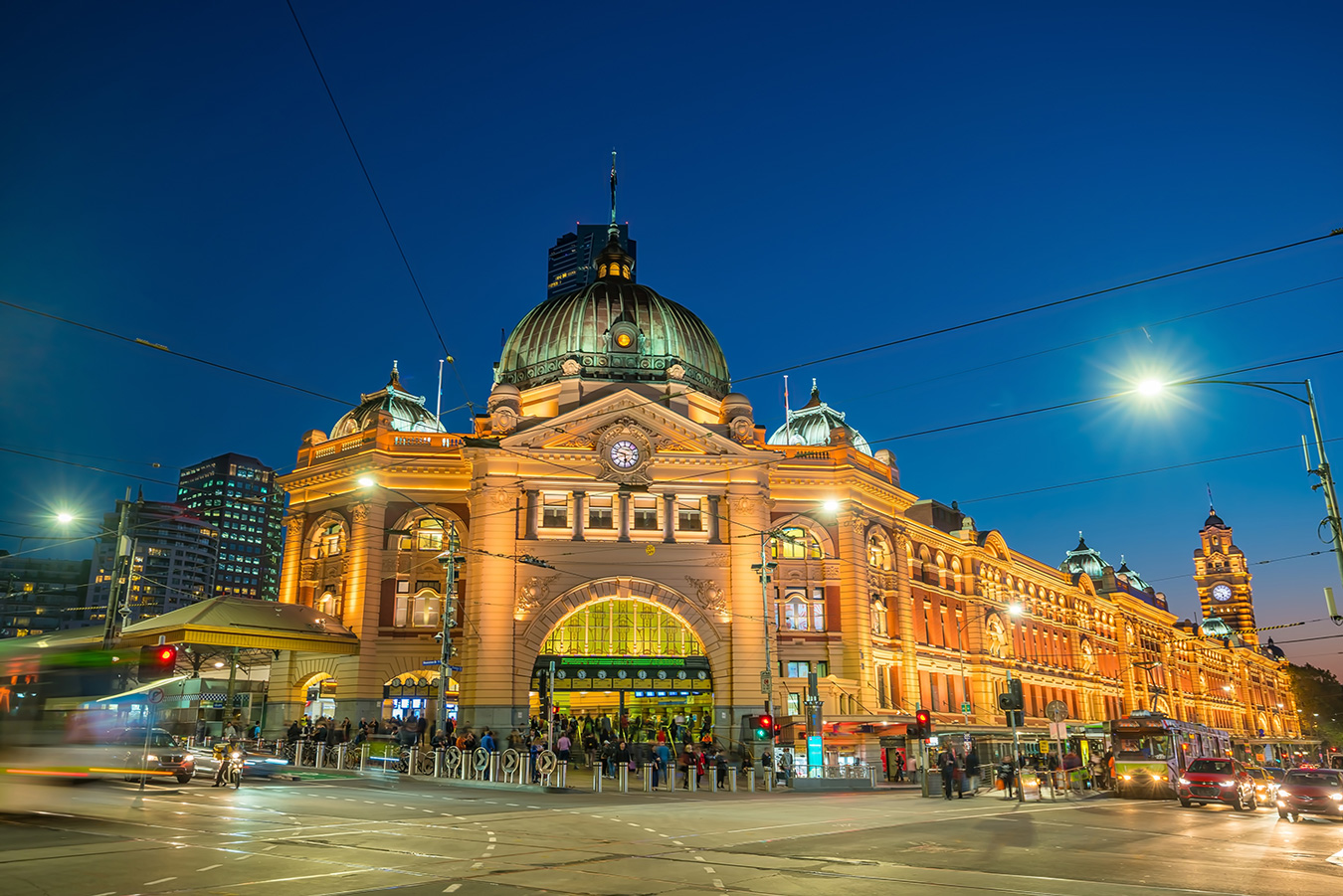 Flinders Street Station illuminated at night in Melbourne