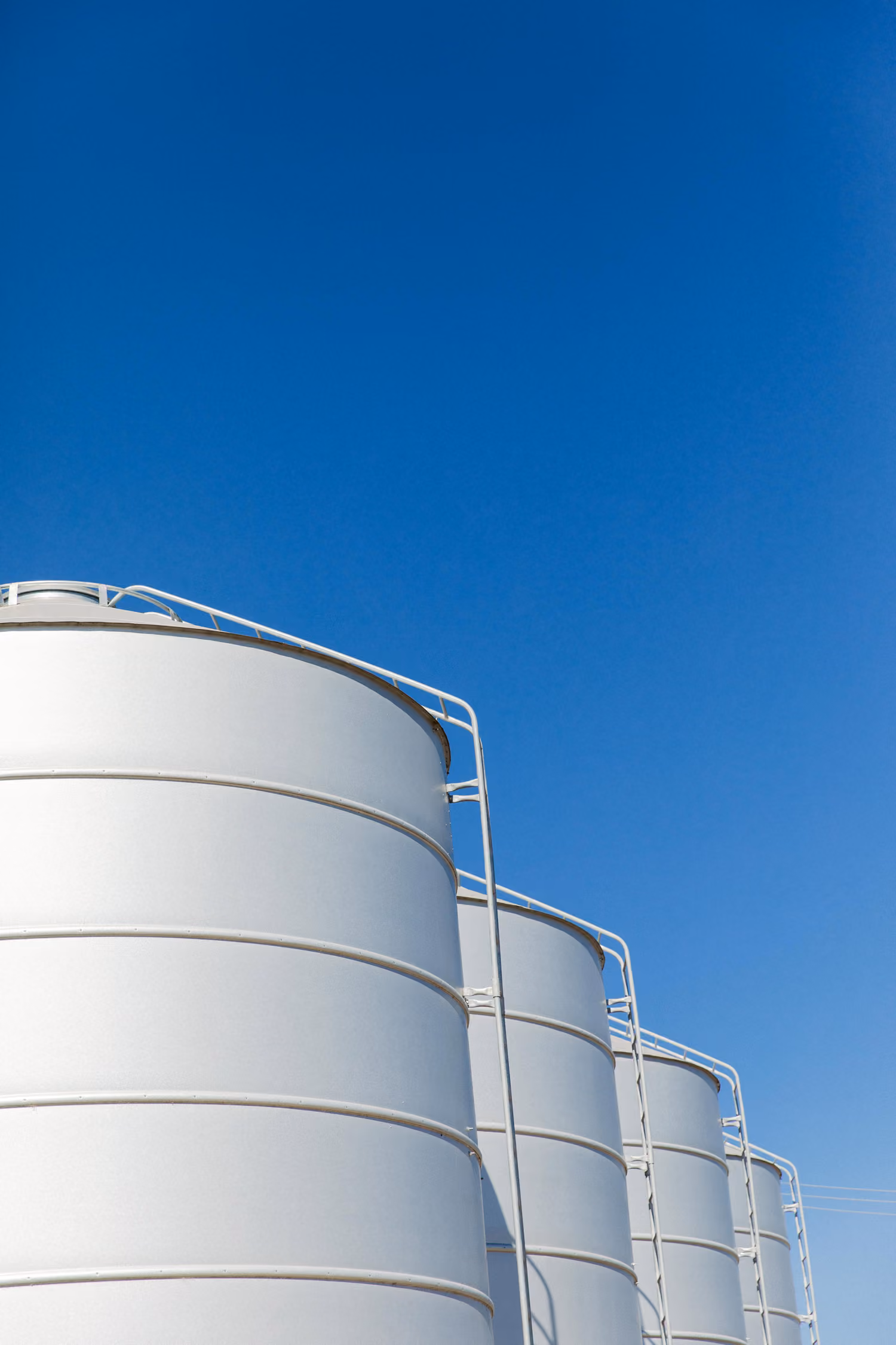 Four large grain silos.