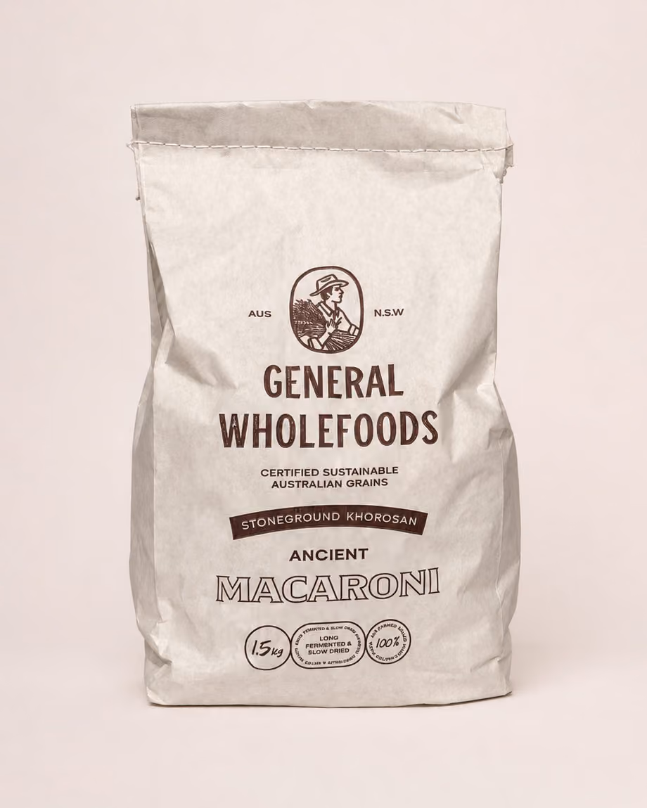Package of General Wholefoods Ancient Shells stoneground spelt pasta with a window showing shell-shaped pasta inside.