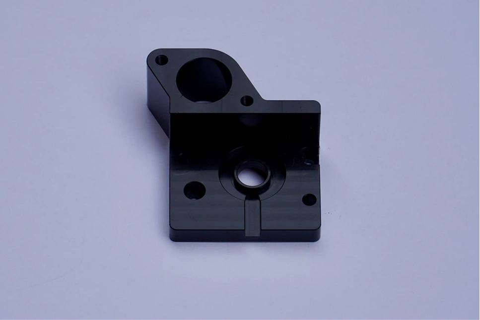 Black-finished milled mounting block with precision holes