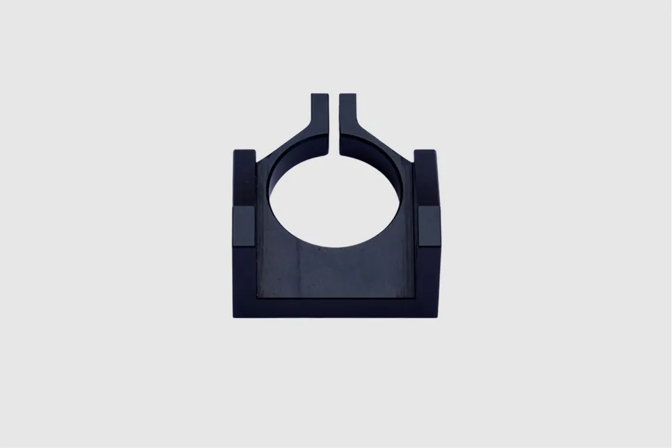 Black-finished metal bracket with circular clamping opening