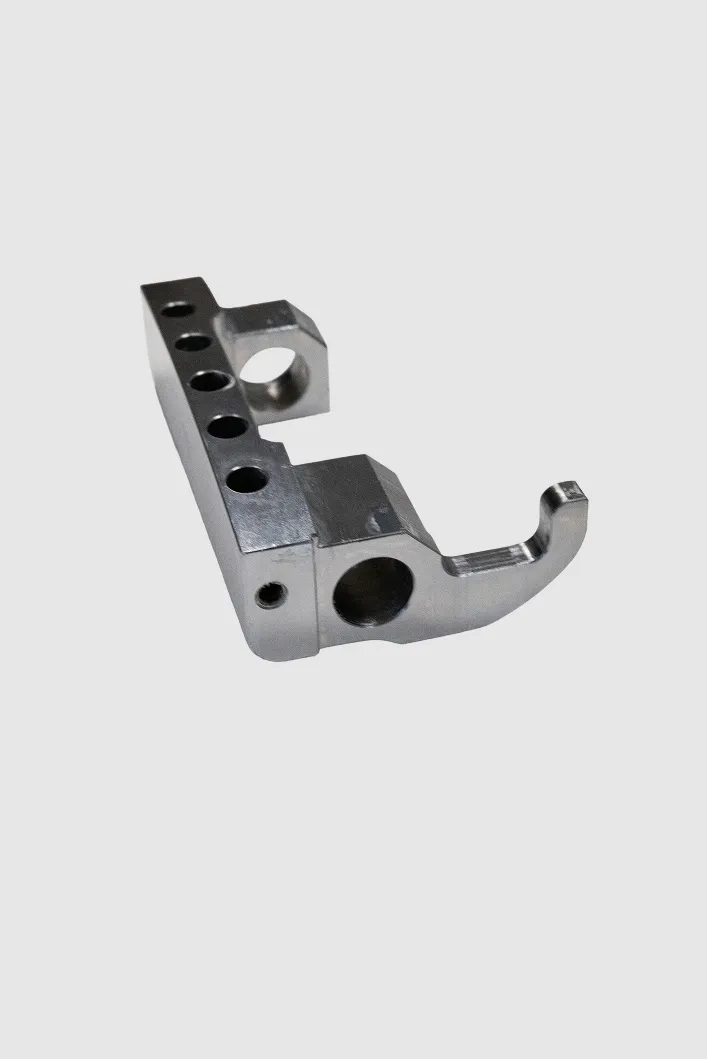 Precision-milled metal bracket with arm and mounting holes