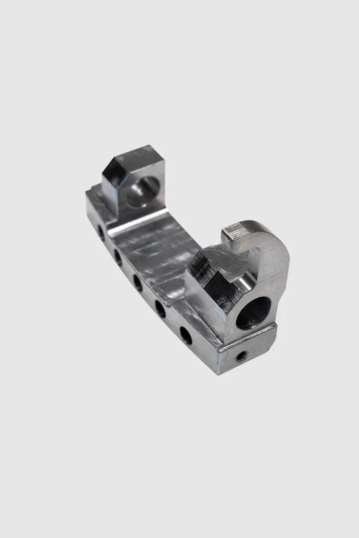 Precision-milled aluminium bracket with a row of holes