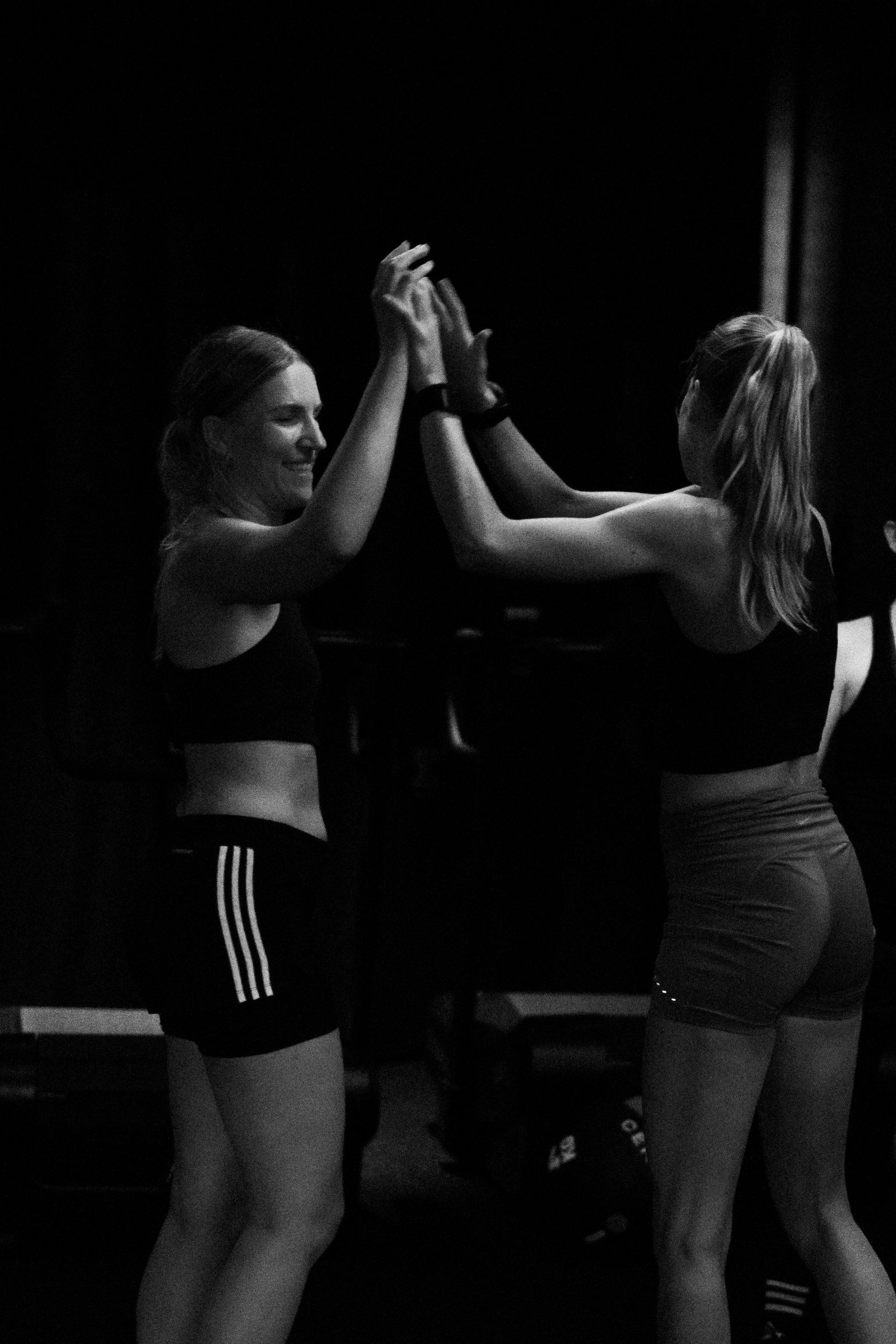 coach and athlete high-fiving after a set