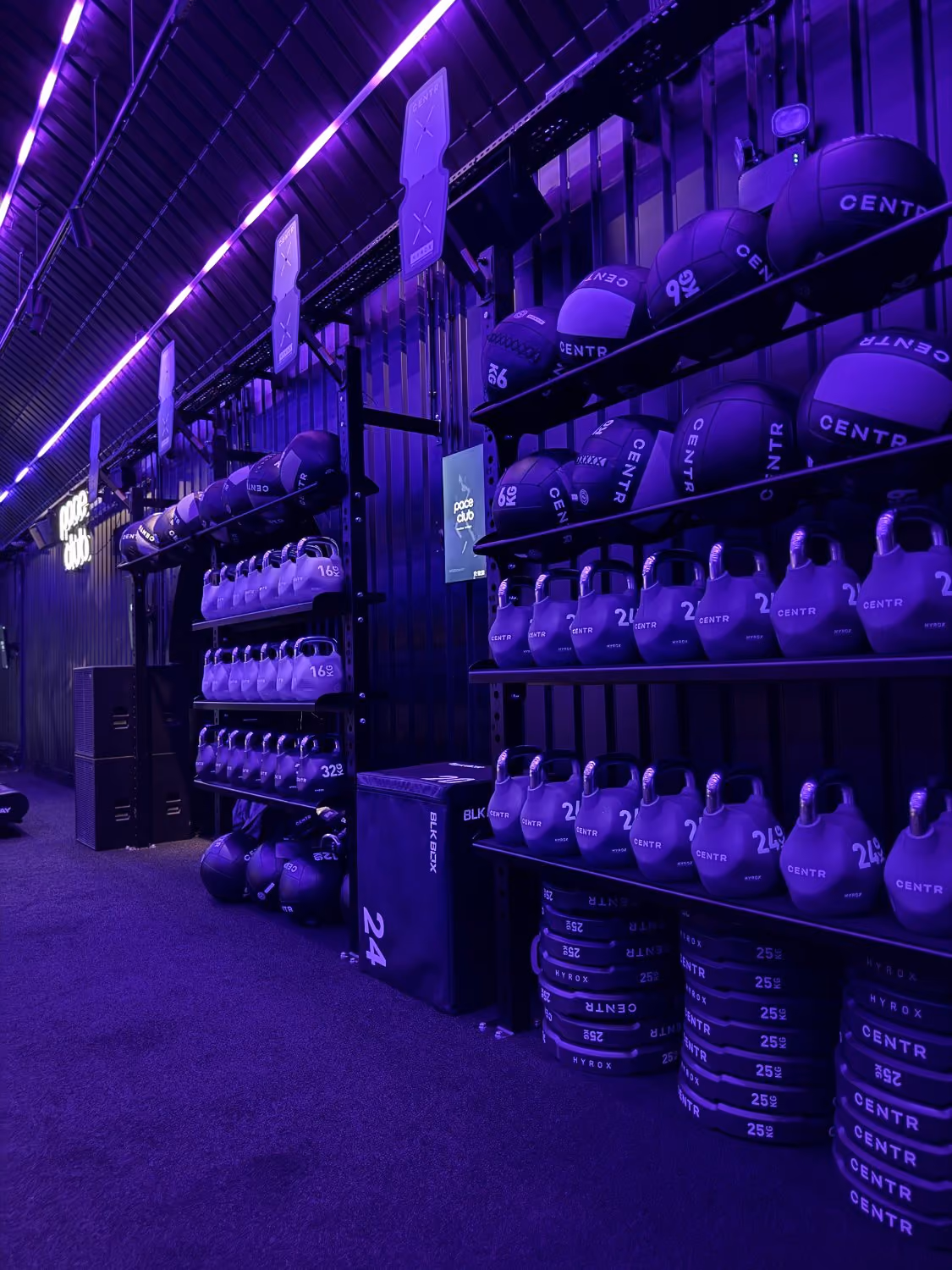 kettlebells, wall balls and plates on the station wall