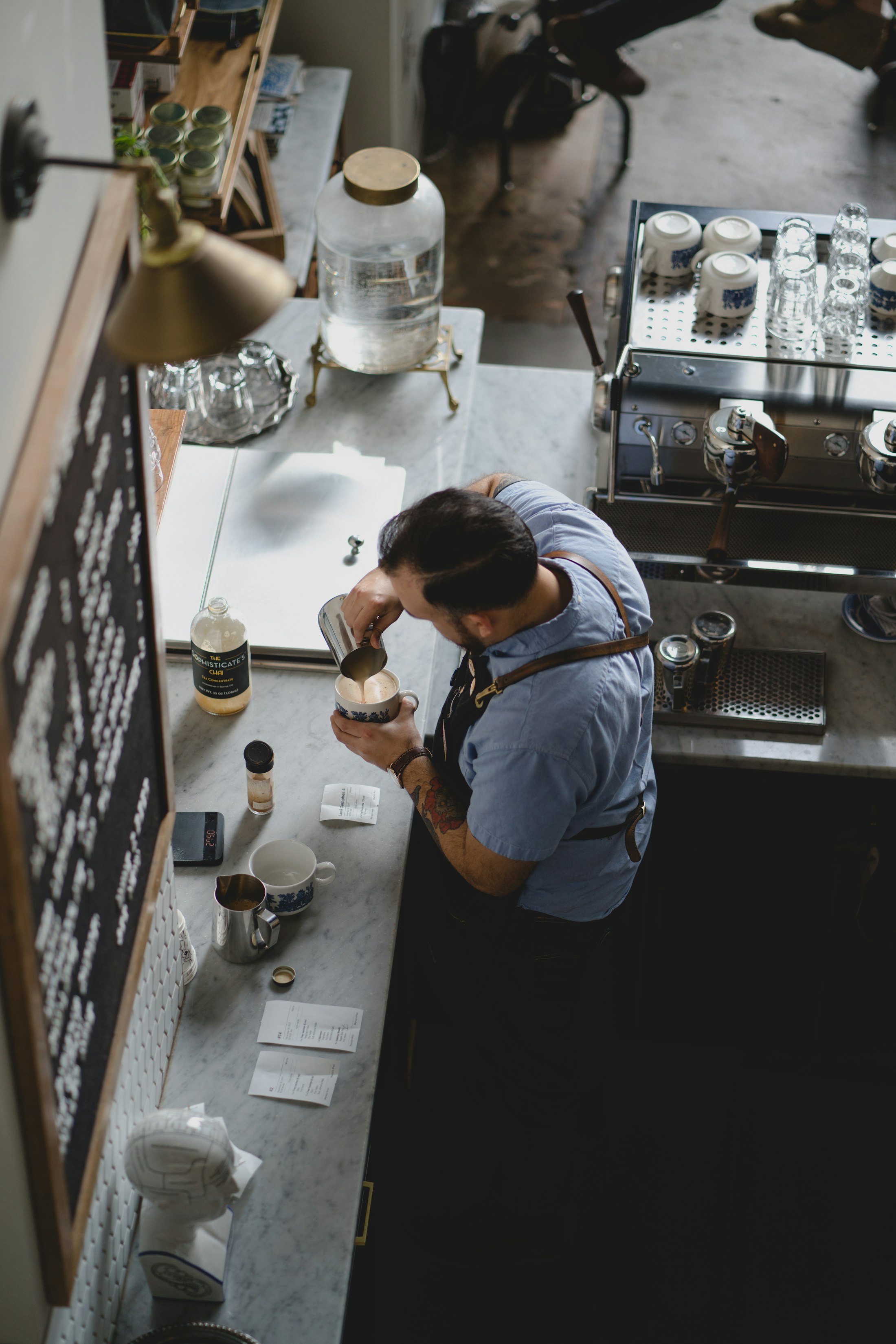 A barista working at the coffee bar, photographed from above