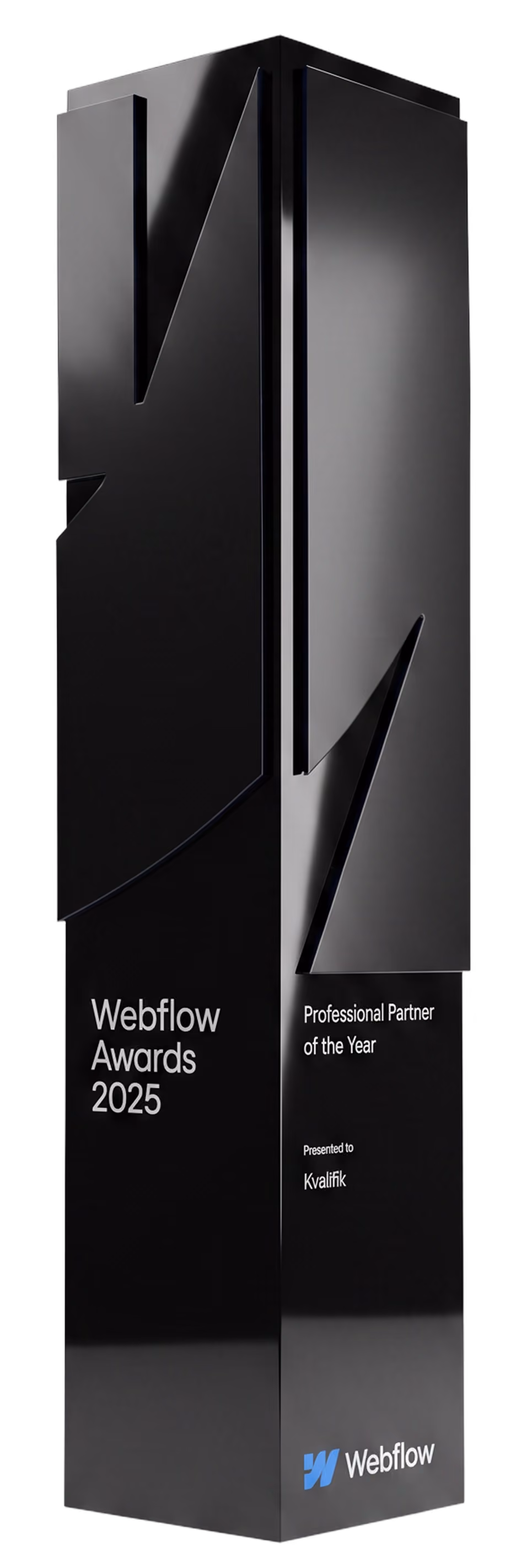 Black, tall, modern award trophy with sharp geometric design engraved with 'Webflow Awards 2025,' 'Professional Partner of the Year,' and 'Presented to Kvalifik,' featuring the Webflow logo at the base.