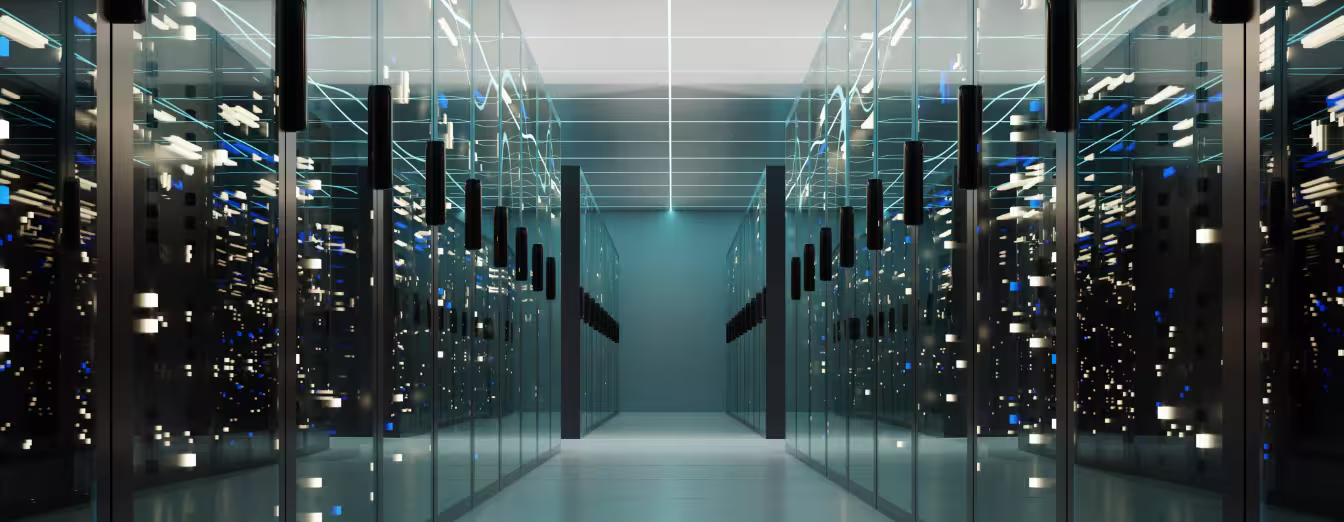 Clean, modern data center corridor lined with enclosed glass server racks illuminated by glowing lights.