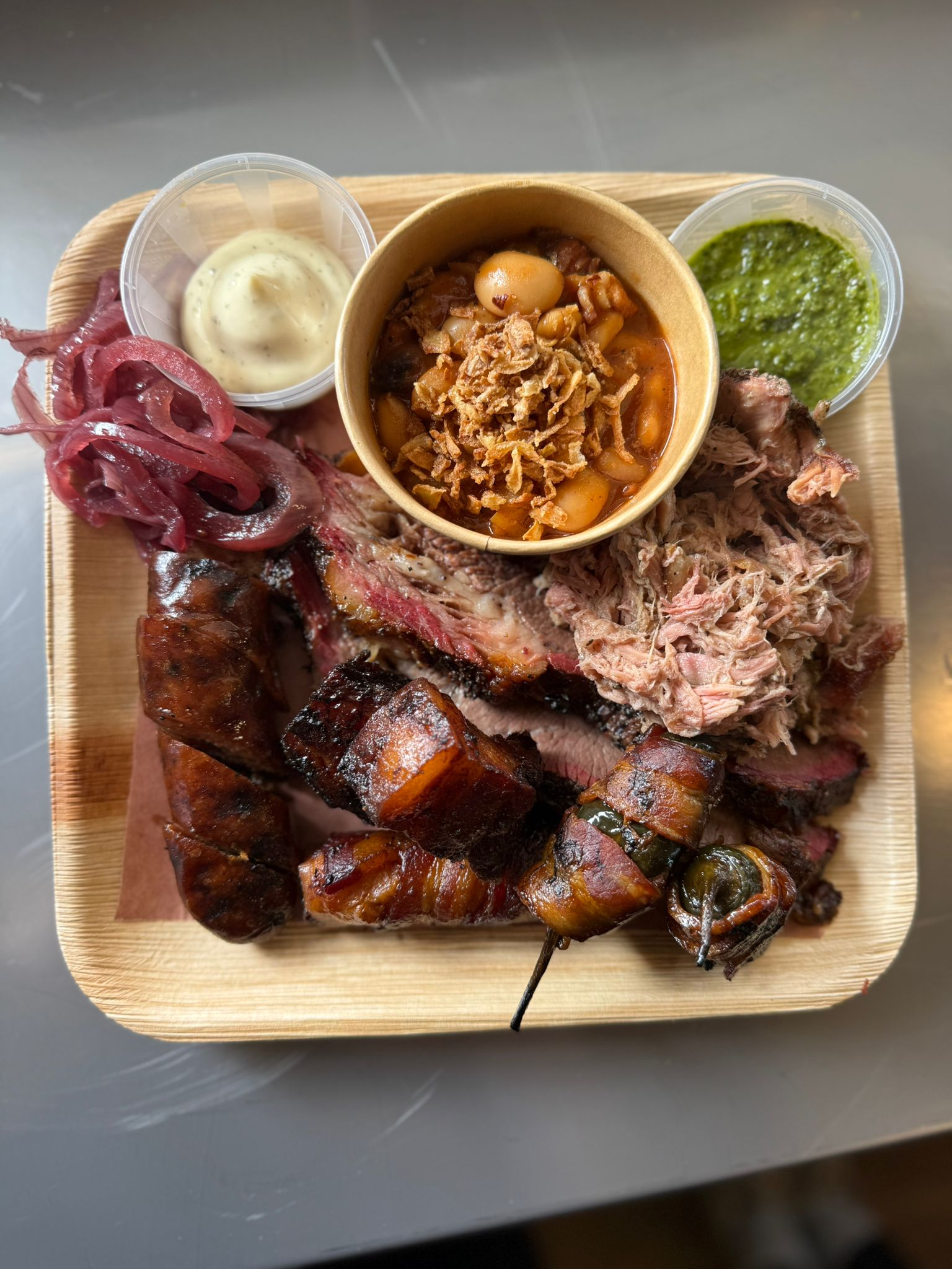 Smokey Joes smoked meat platter with sides and pickles