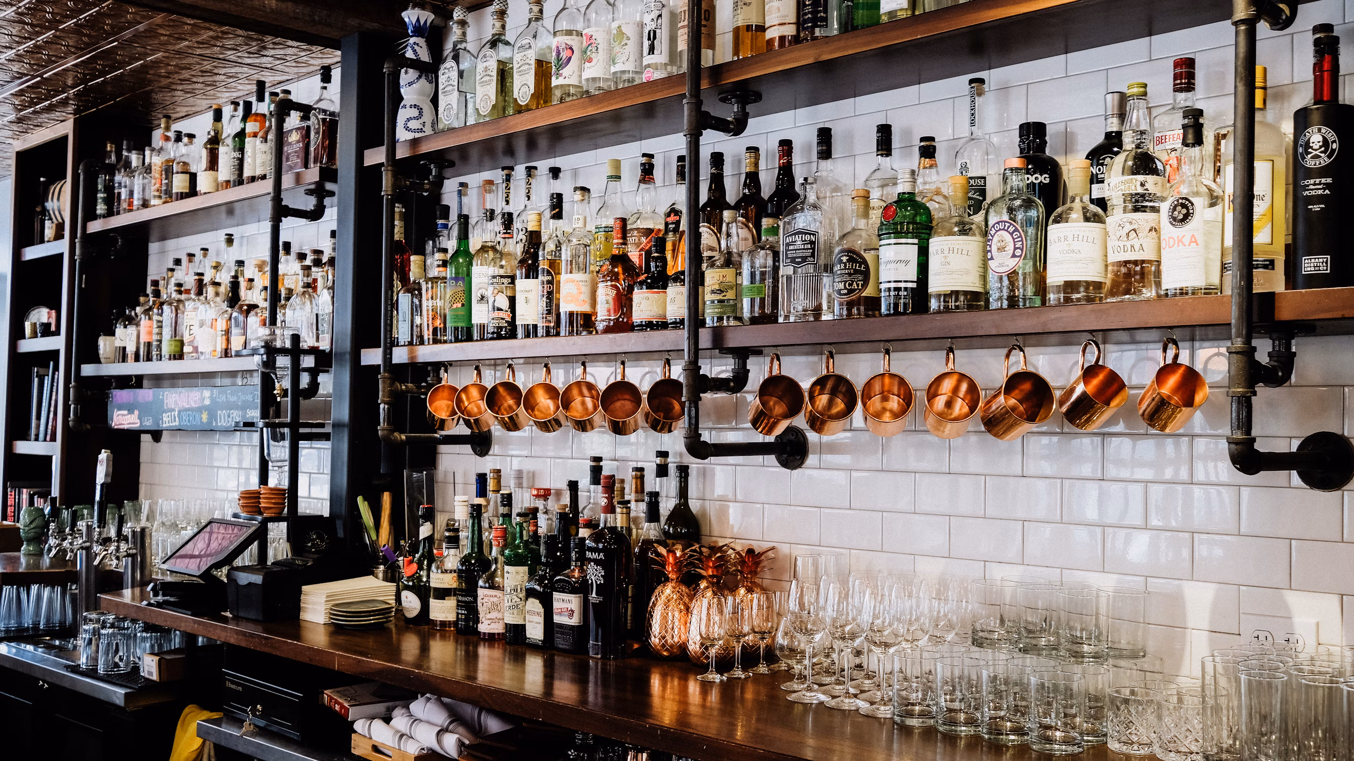 Bottles of alcohol behind a bar