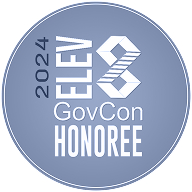 Circular blue badge with white text reading '2024 ELEV8 GovCon HONOREE' and a geometric logo in the center.