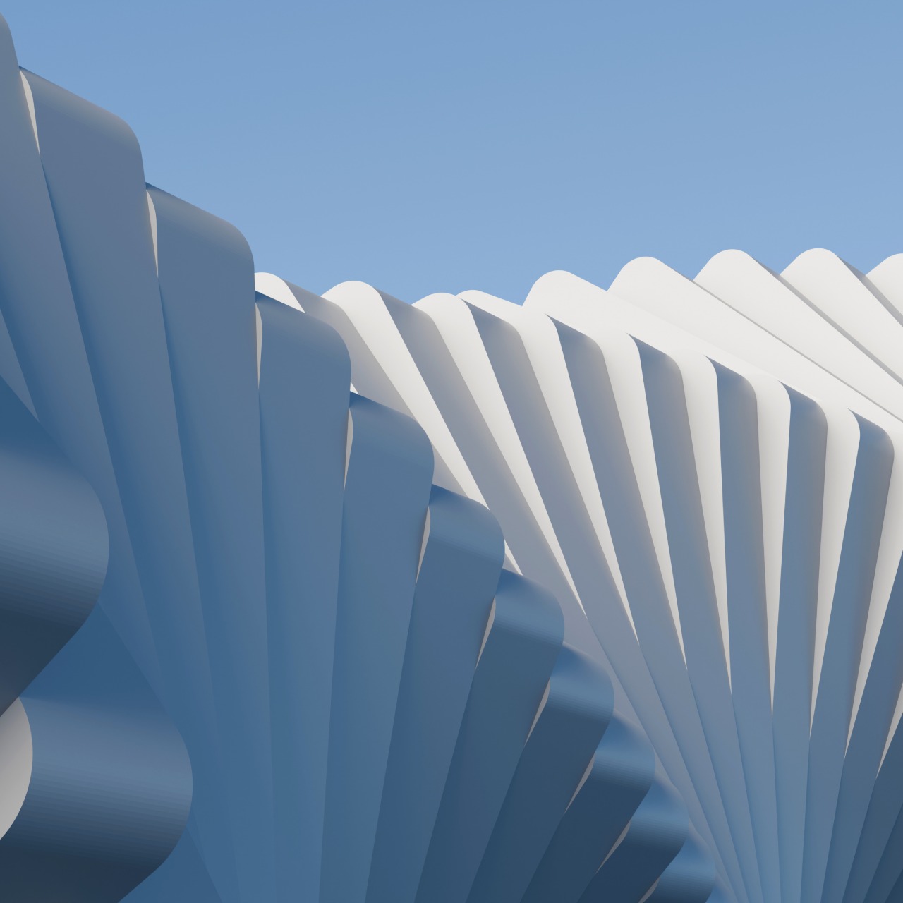 Close-up of abstract, curved, blue and white architectural shapes fanning out against a clear blue sky.