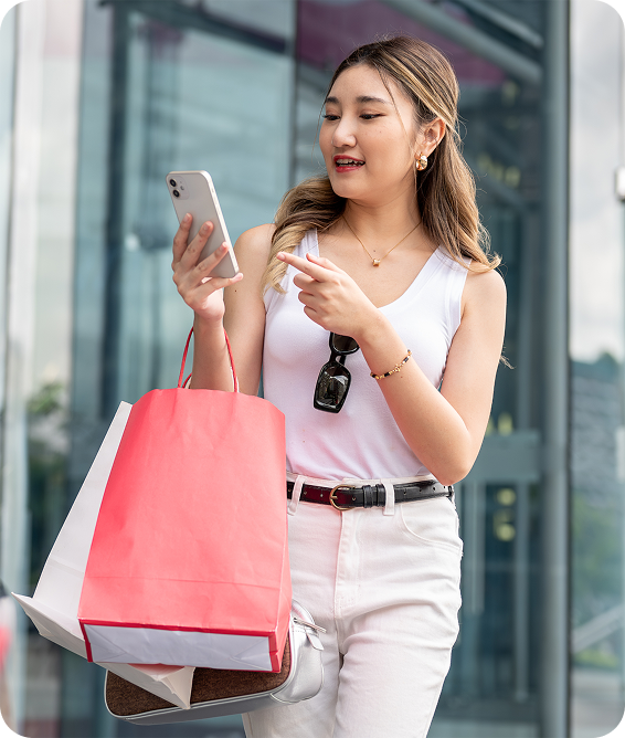 Woman shopping and paying with her phone