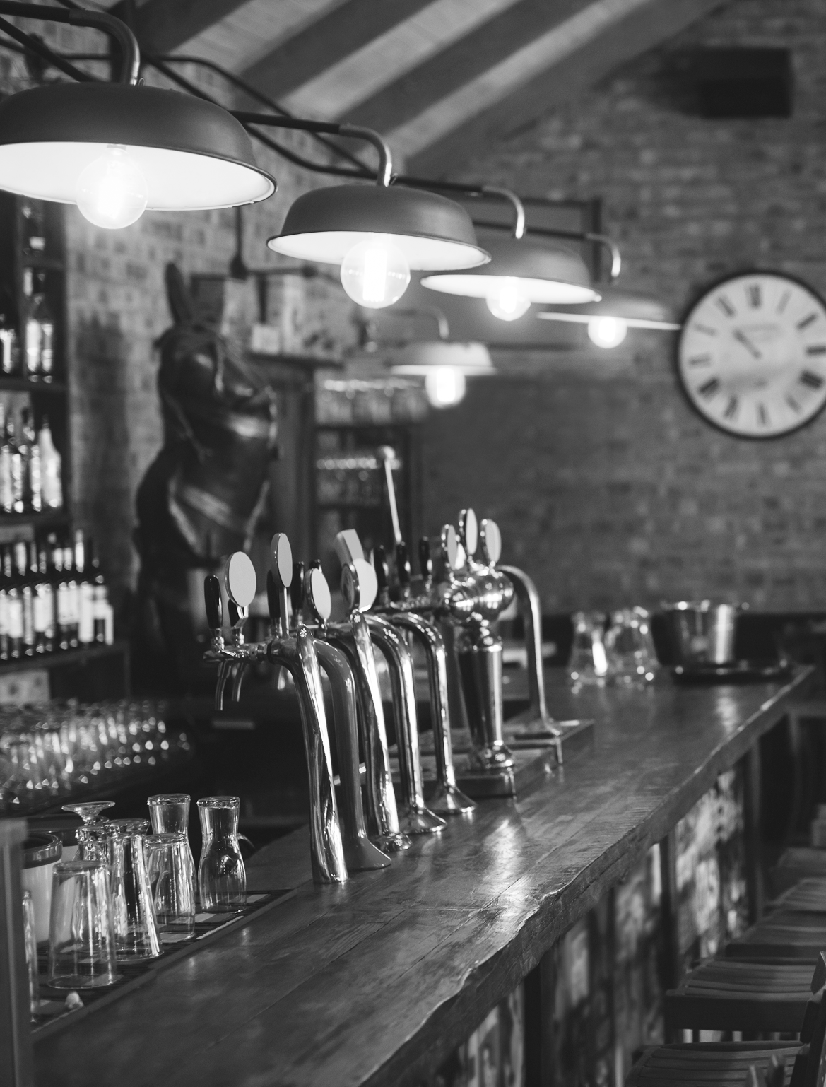 Pub bar counter with beer taps in black and white