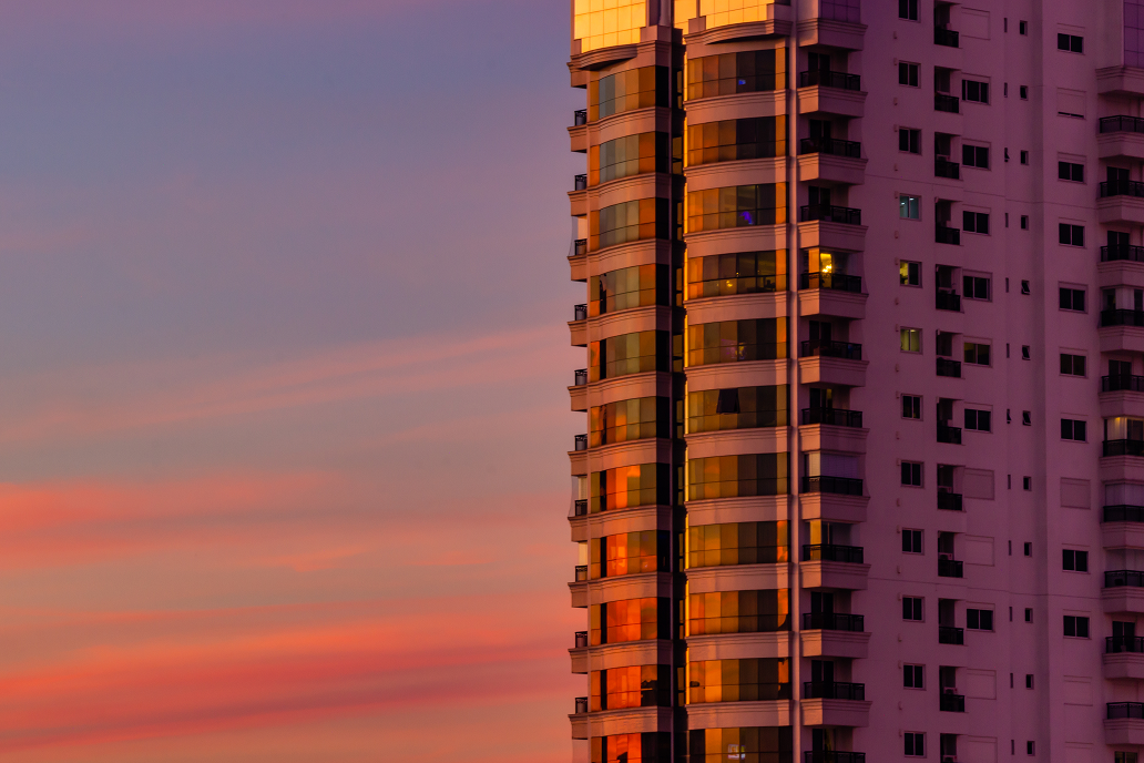 High-rise residential tower at sunset