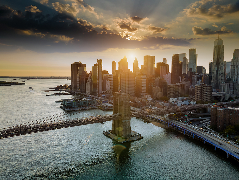 Aerial view of the Brooklyn Bridge and Lower Manhattan at sunset