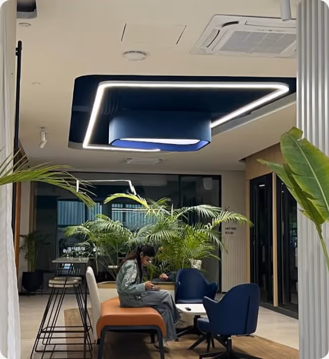 BuildIT communal workspace with plants and lounge seating