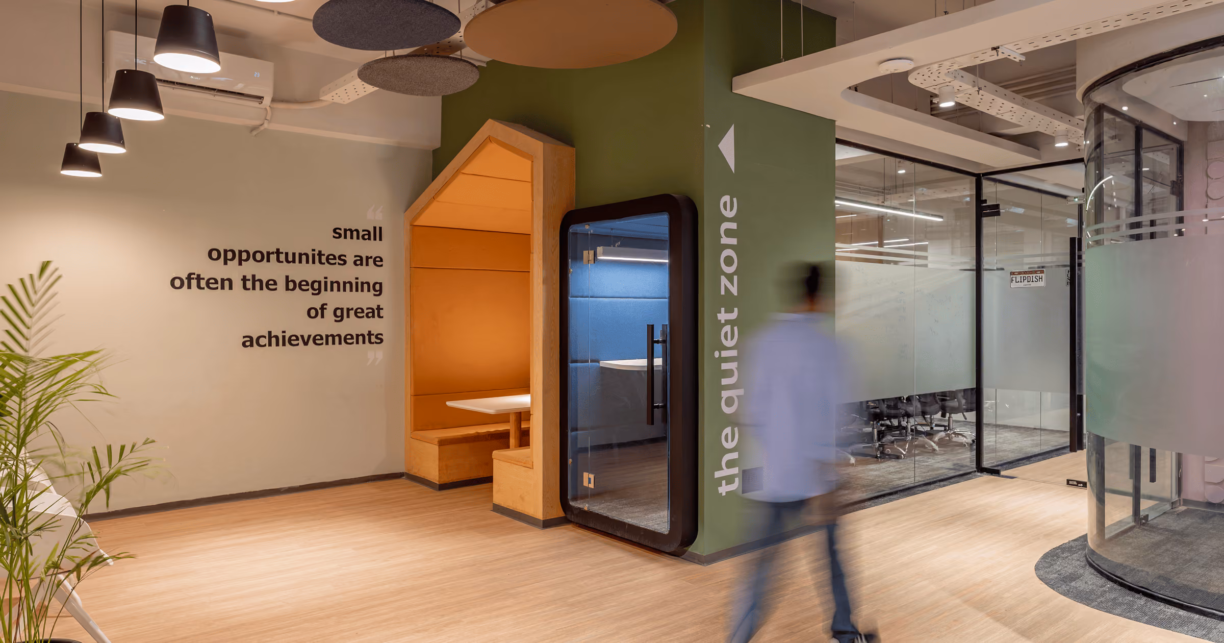BuildIT communal workspace with plants and lounge seating