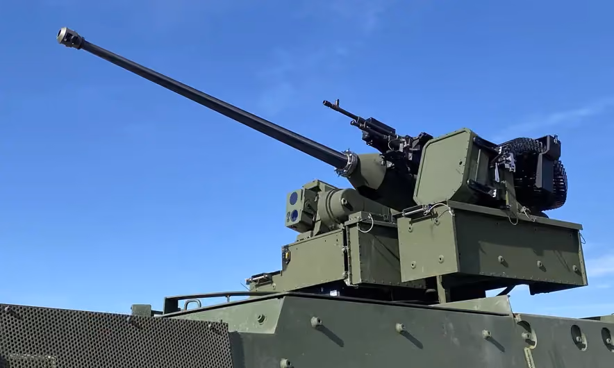 Grey vehicle with mounted EchoShield radars against a black background with grey hexagon pattern