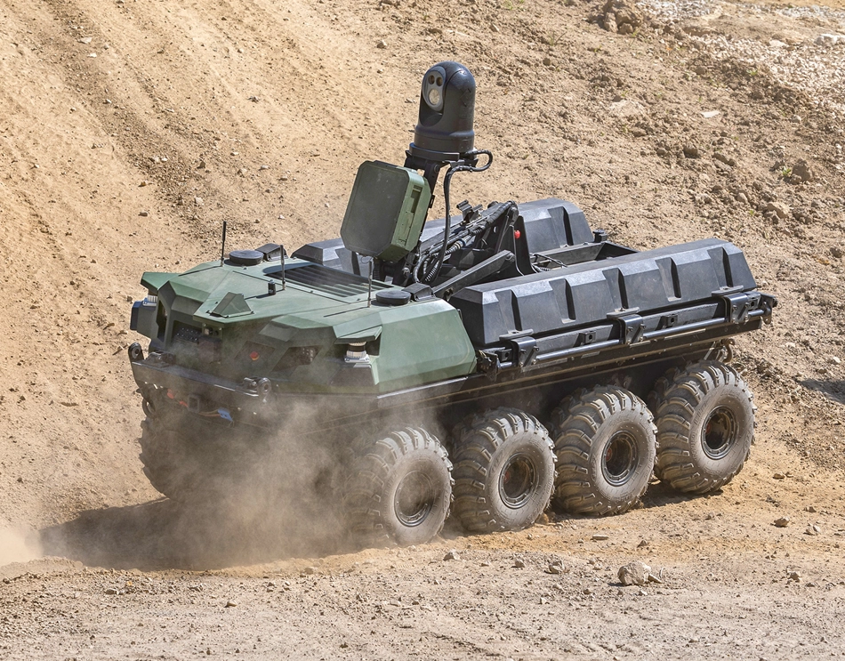 Grey vehicle with mounted EchoShield radars against a black background with grey hexagon pattern