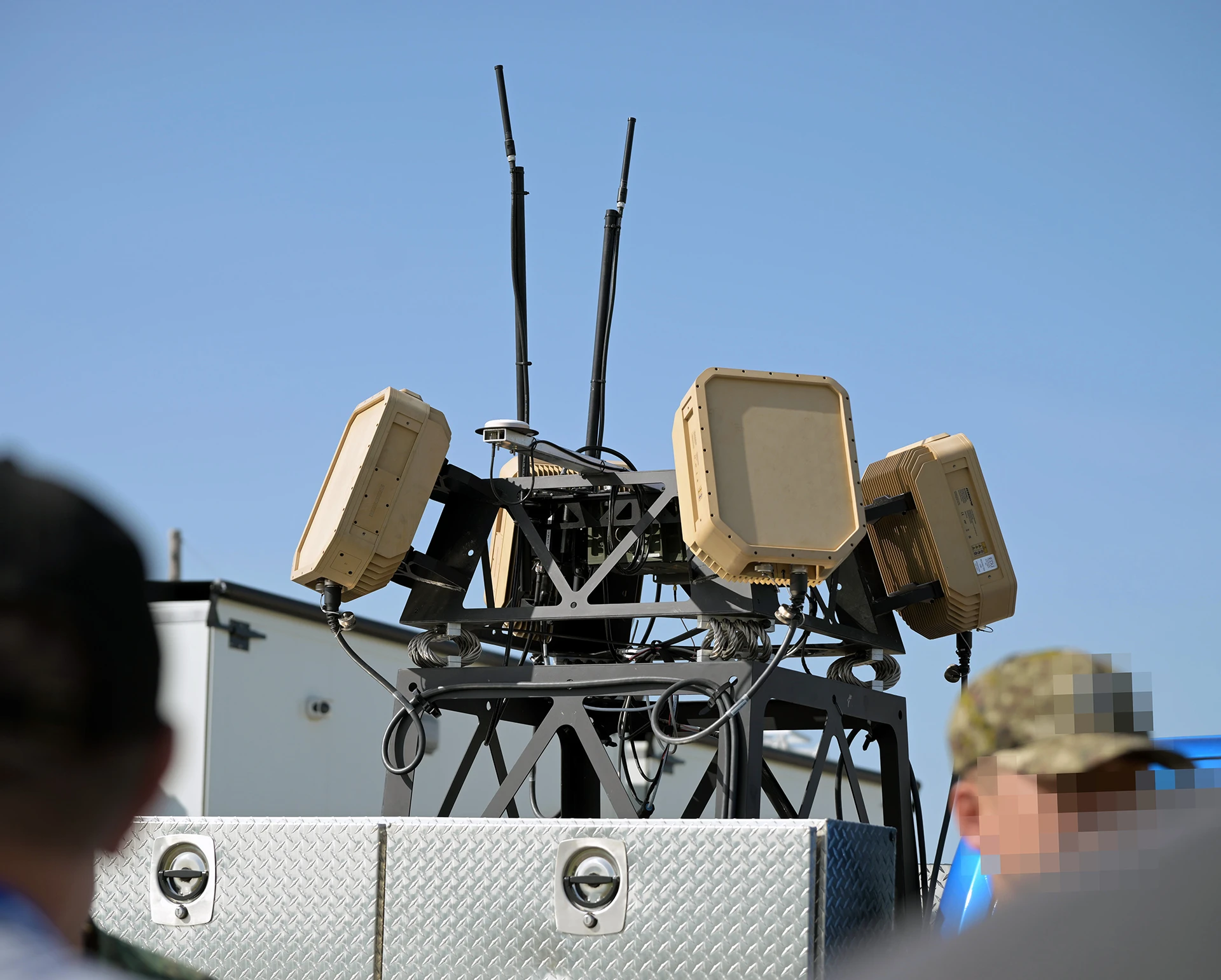 Close-up of a EchoShield sensor system mounted on a metal platform with blue sky background.