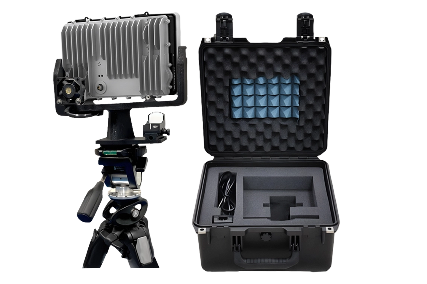 Metal device mounted on tripod next to an open black carrying case with foam inserts and a coiled cable.