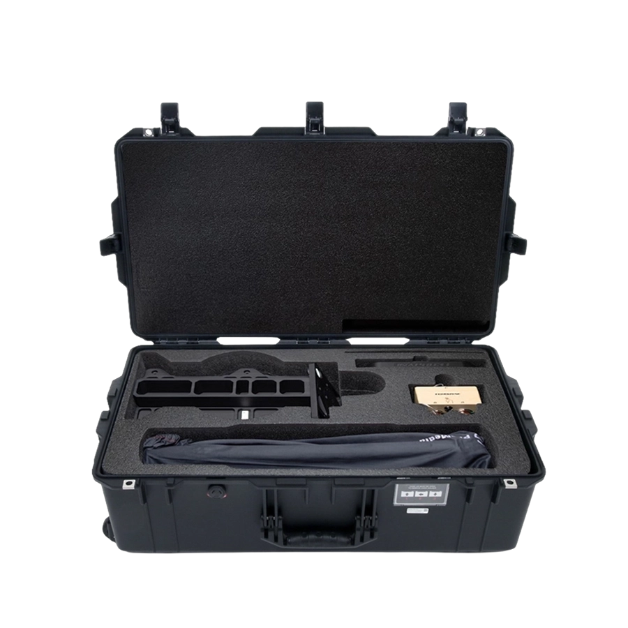 Open black hard case with foam compartments holding a tool, a wrapped item, and a control box.