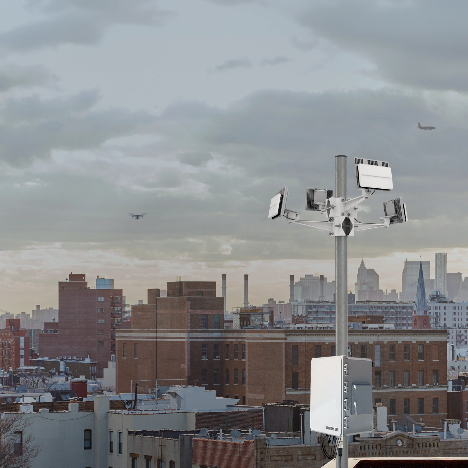 4 echodyne radars mounted to a pole in an urban setting