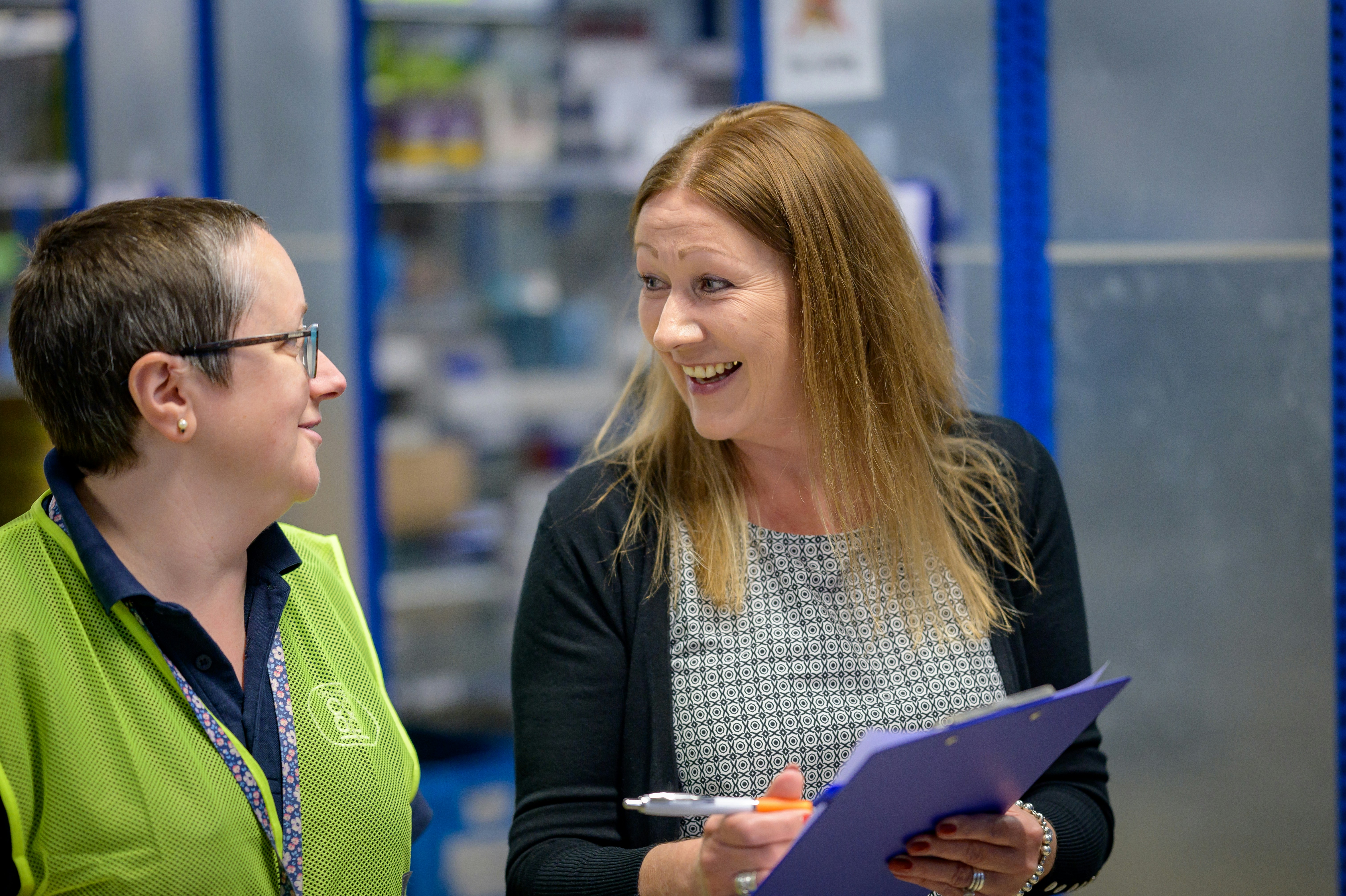 Two colleagues discussing a long-term wholesale partnership