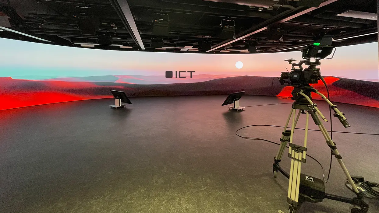Camera in front of a curved LED wall in the SPARK corporate studio.
