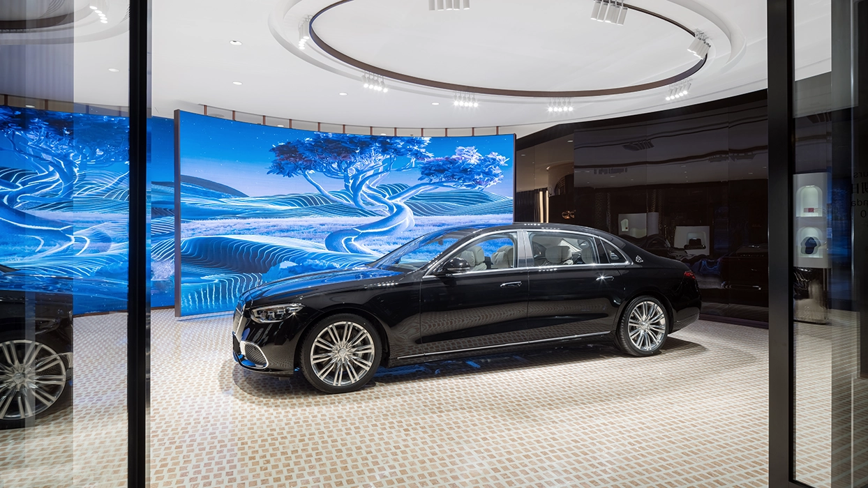 Curved LED elements beneath a circular ceiling rail at the Maybach Atelier Shanghai.