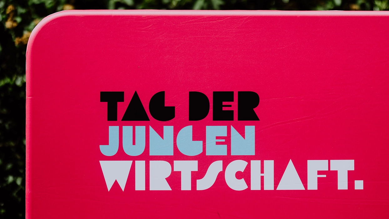 Pink bench with a sign