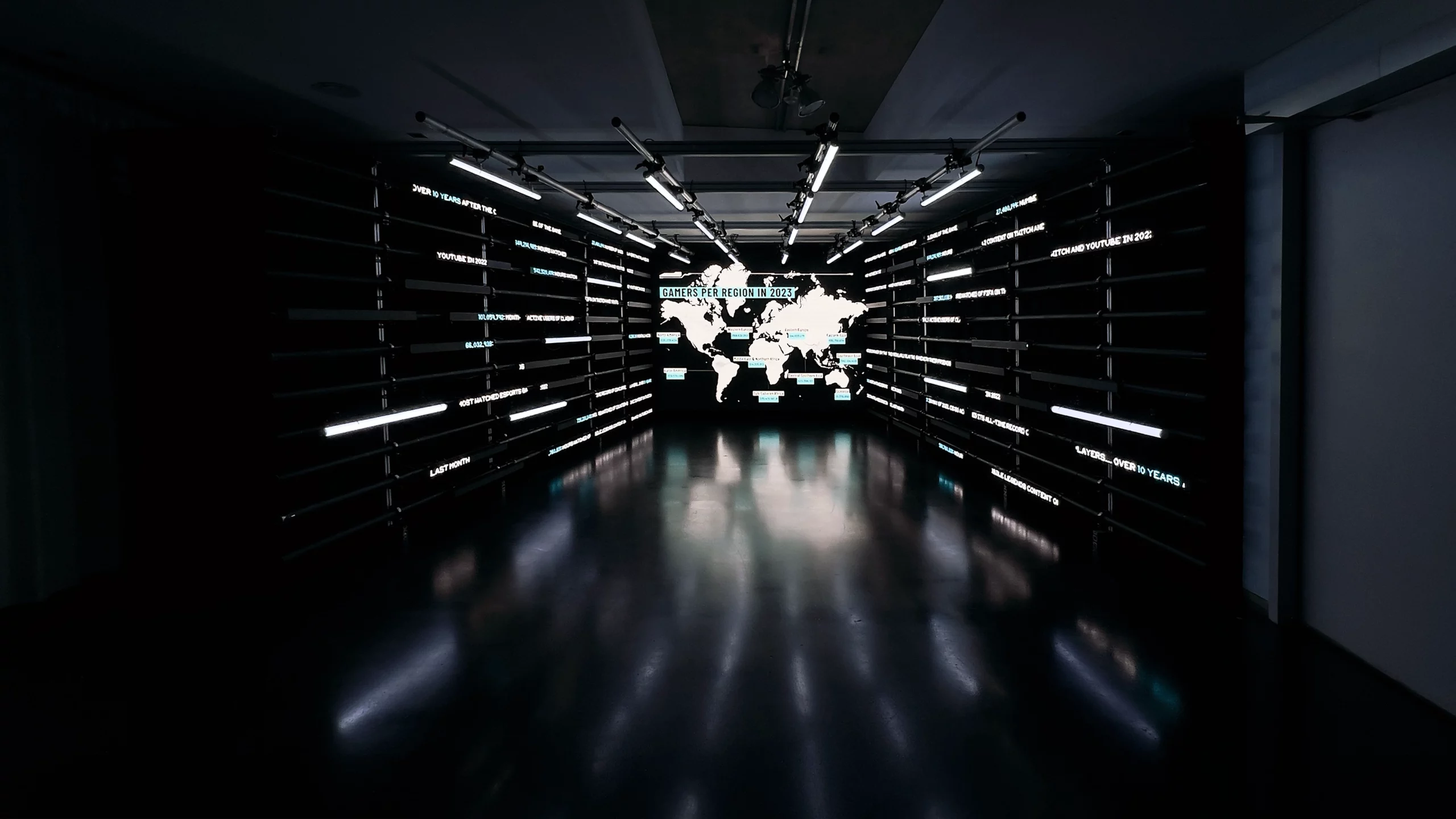 A dark corridor with many lights.