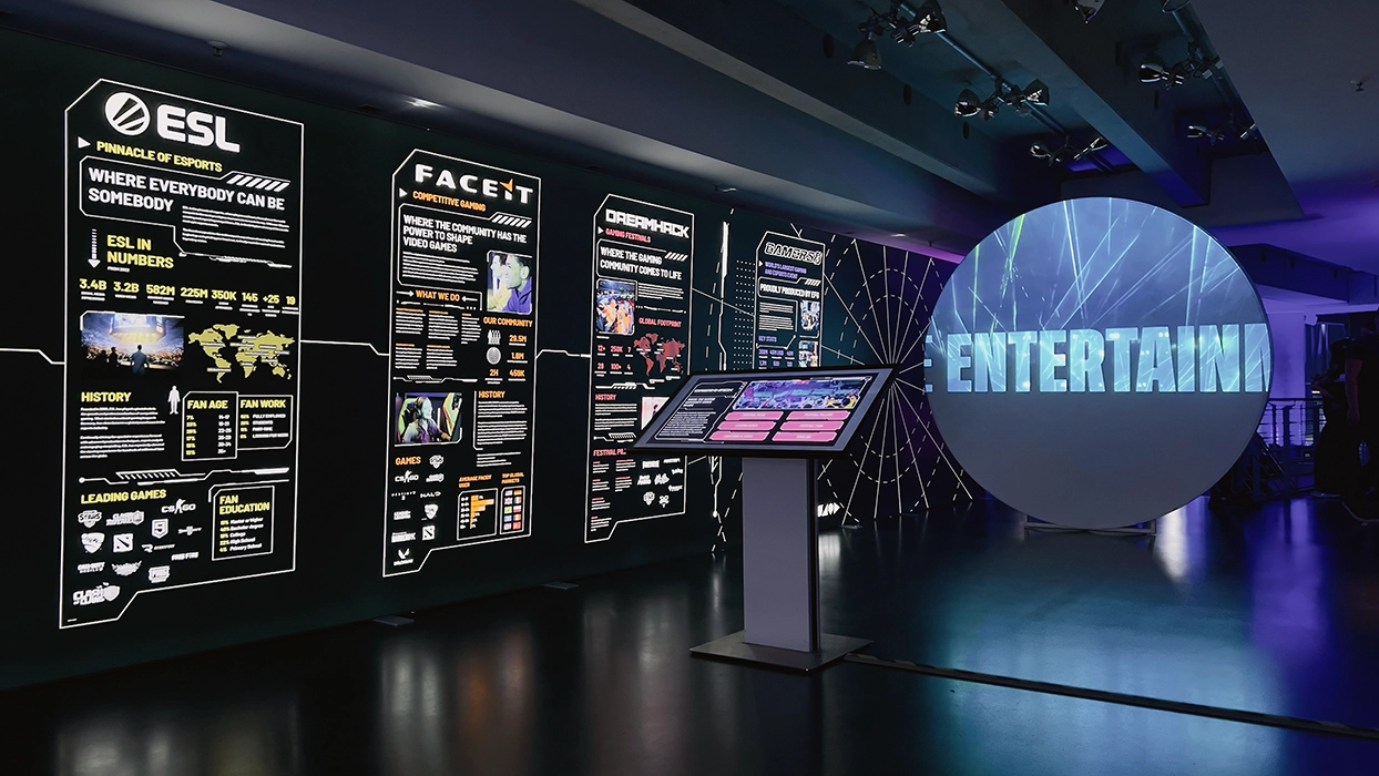 A room with an exhibition of information about esports.